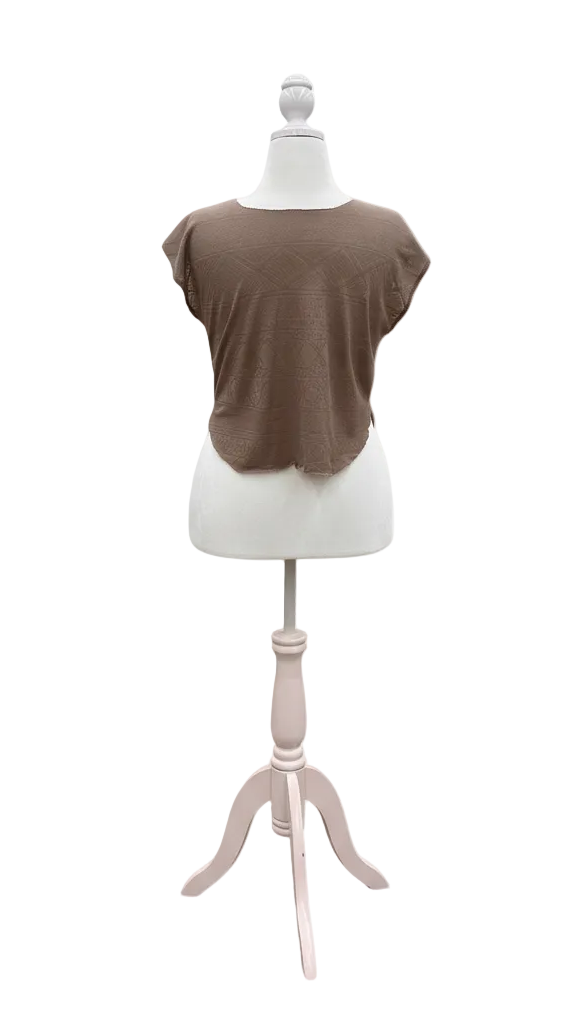 Mannequin wearing a brown shirt on a white background