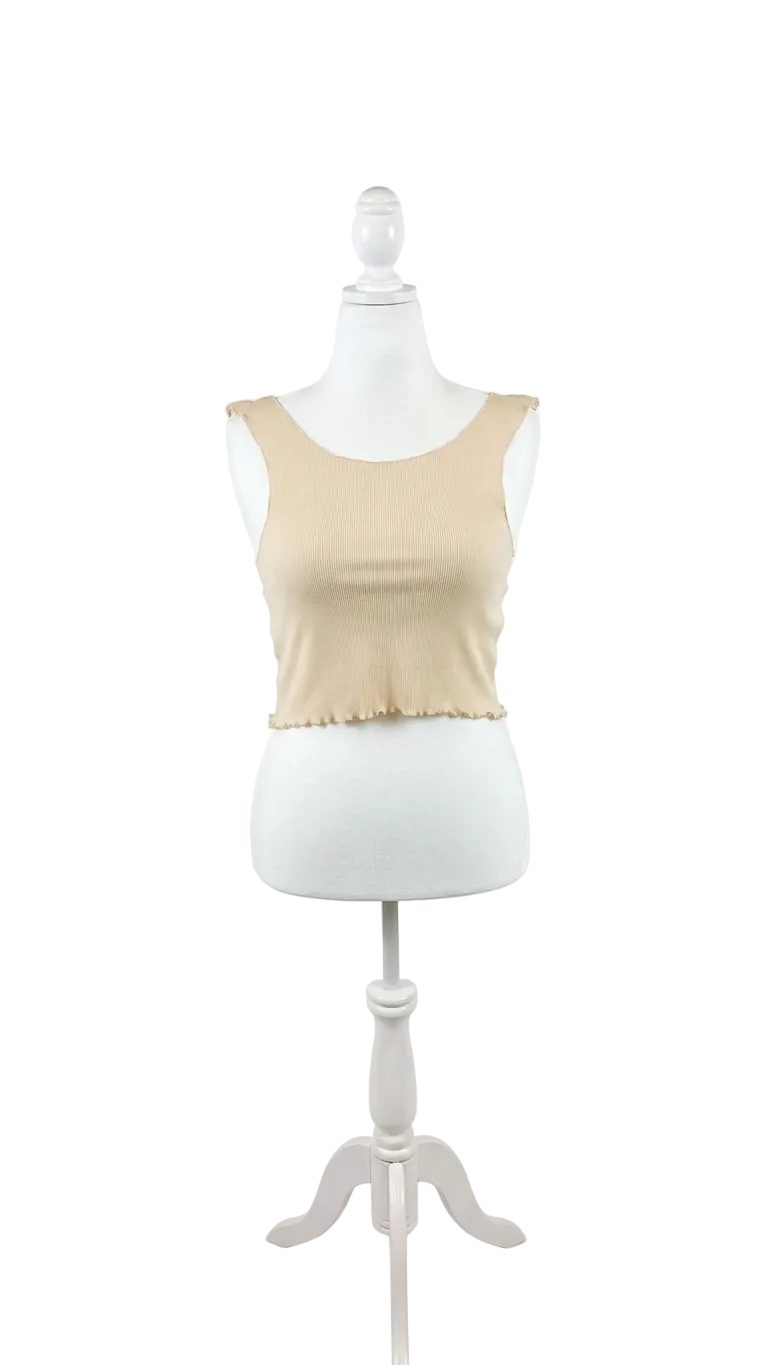 Beige tank top on a mannequin against a white background