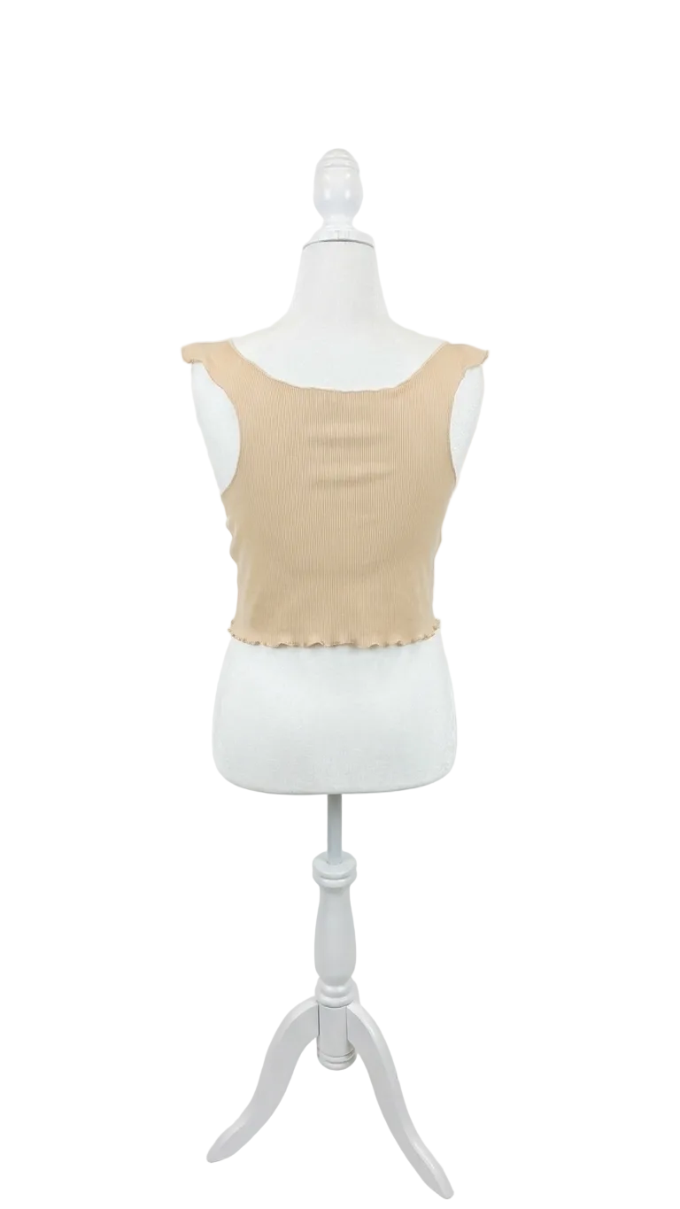 Beige tank top on a mannequin against a white background