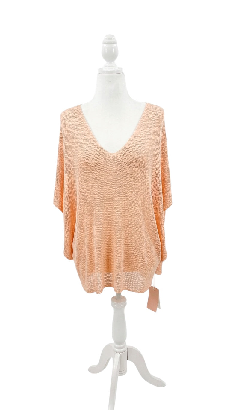 Blush -colored sweater on a mannequin against a white background