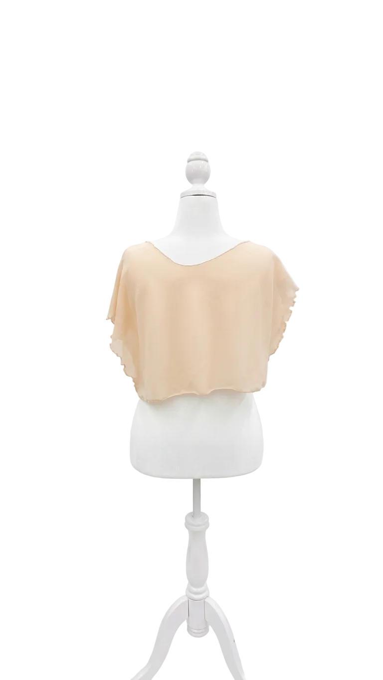 Beige top on a mannequin against a white background