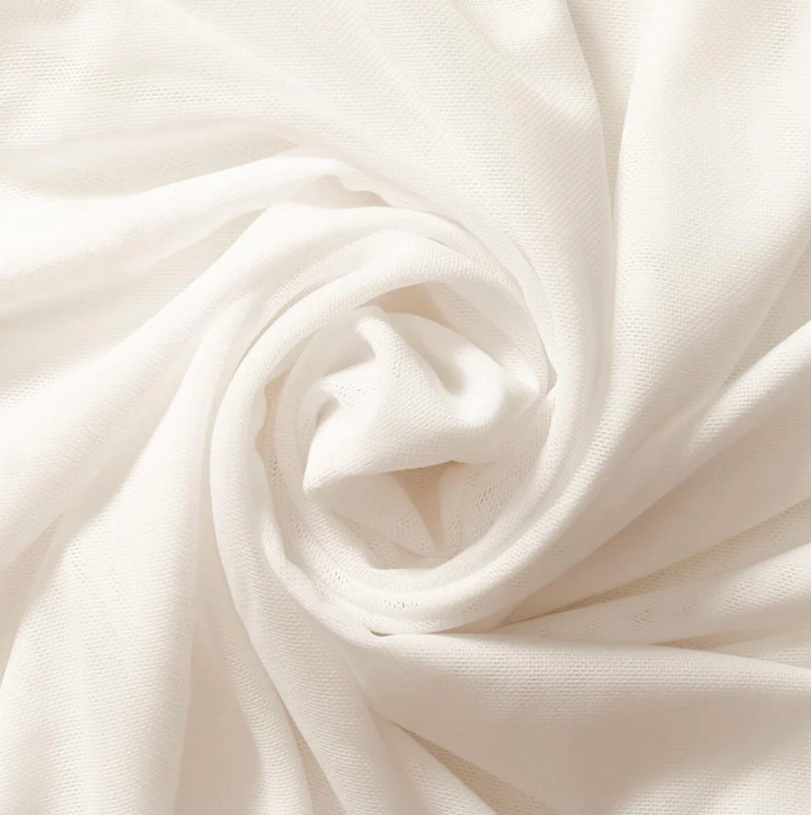 Close-up of white fabric with folds