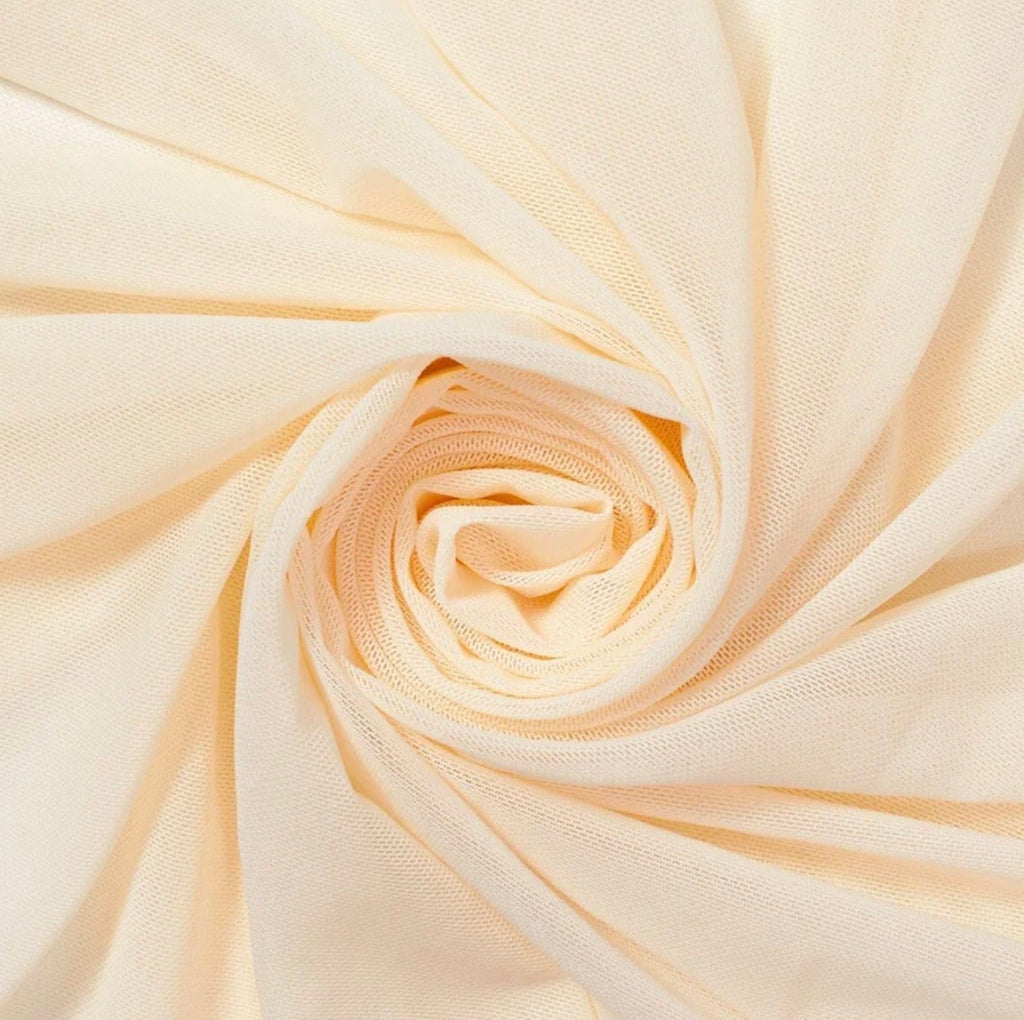 Close-up of beige fabric with a spiral pattern