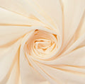 Close-up of beige fabric with a spiral pattern
