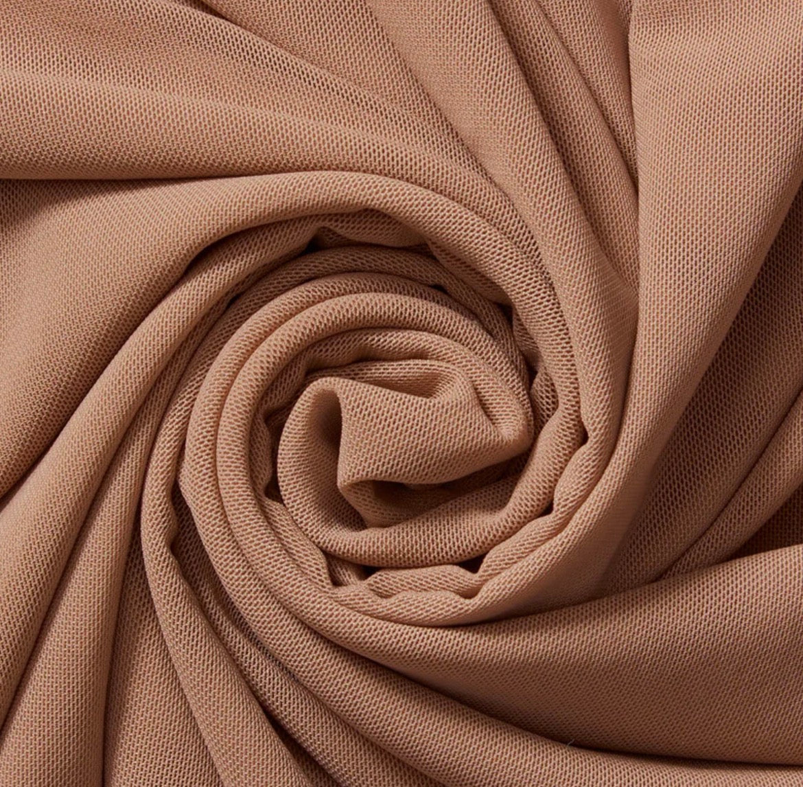 Close-up of beige fabric with a textured surface
